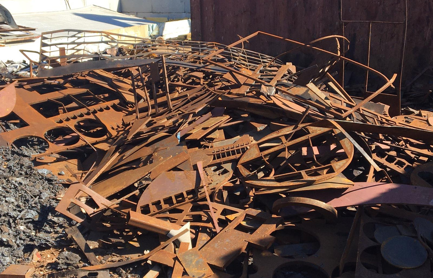 Sorted ferrous scrap steel piled in the recycling yard