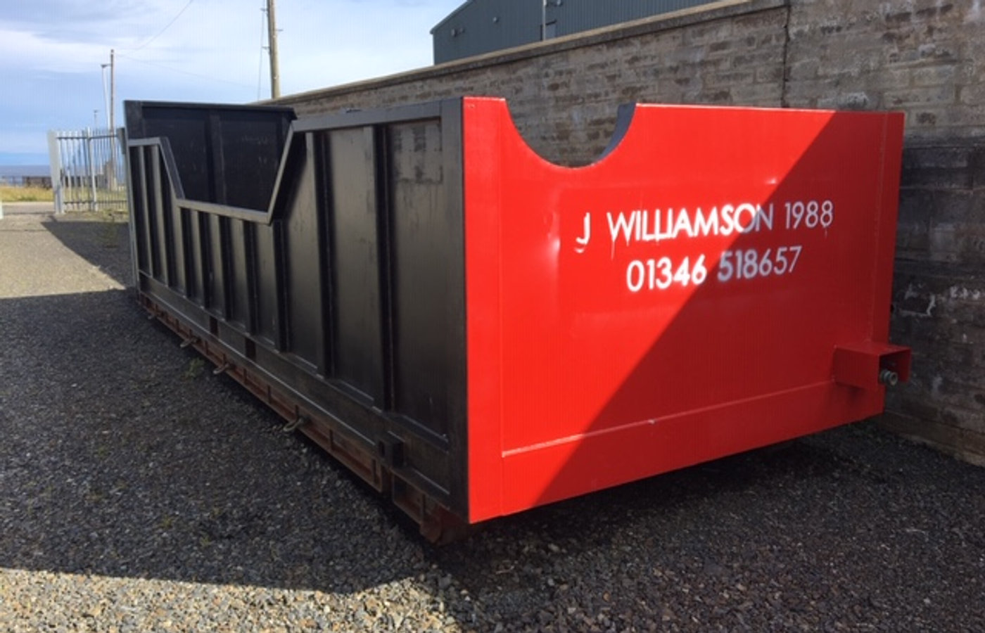Row of skips ready for delivery from the yard